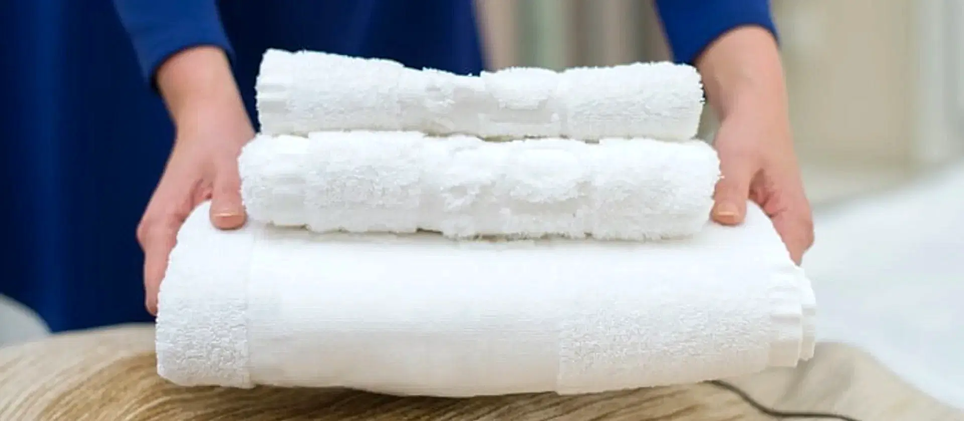 Woman Changing Hotel Room Towels Min (1)